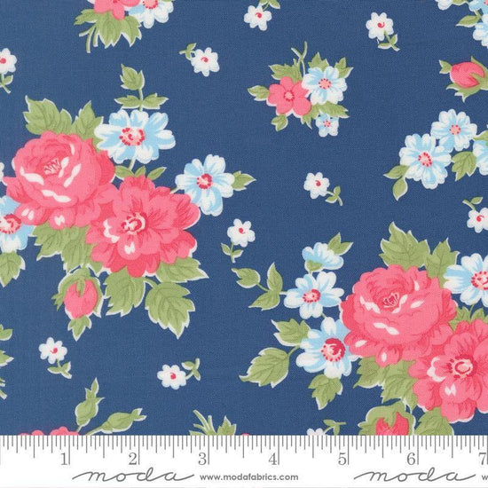 Image of A Cat Named Stitch Blooming Florals Sea quilting cotton fabric by Camille Roskelley for Riley Blake Designs. Features flowers on a blue background. Cute Little Fabric Shop.