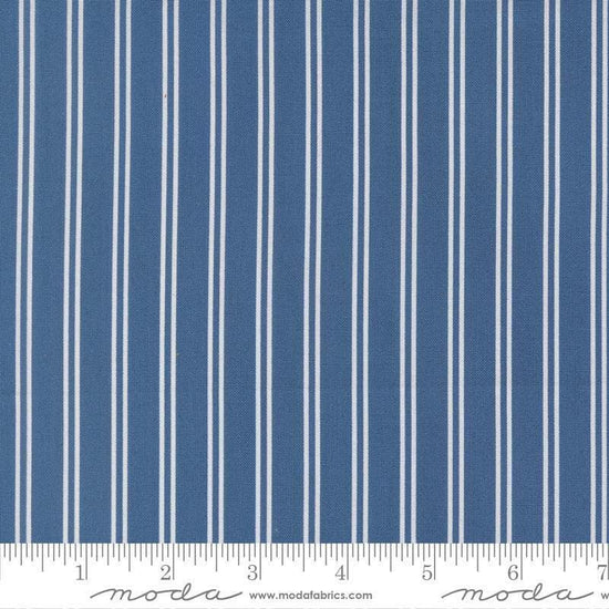 Image of A Cat Named Stitch Stripes Sea quilting cotton fabric by Camille Roskelley for Riley Blake Designs. Features stripes on a blue background. Cute Little Fabric Shop.
