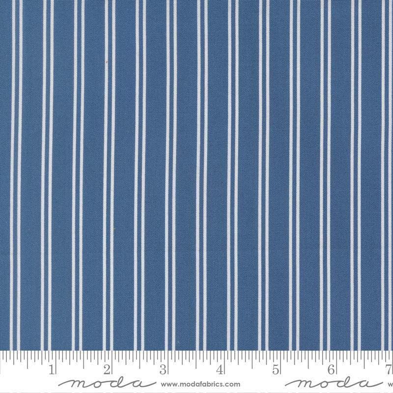 Image of A Cat Named Stitch Stripes Sea quilting cotton fabric by Camille Roskelley for Riley Blake Designs. Features stripes on a blue background. Cute Little Fabric Shop.