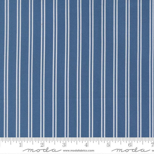 Image of A Cat Named Stitch Stripes Sea quilting cotton fabric by Camille Roskelley for Riley Blake Designs. Features stripes on a blue background. Cute Little Fabric Shop.