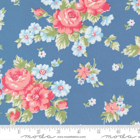 Image of A Cat Named Stitch Blooming Florals Blue quilting cotton fabric by Camille Roskelley for Riley Blake Designs. Features flowers on a blue background. Cute Little Fabric Shop.