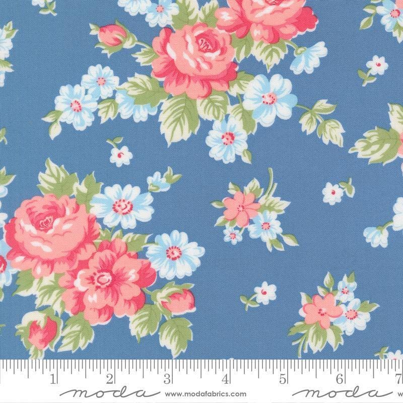 Image of A Cat Named Stitch Blooming Florals Blue quilting cotton fabric by Camille Roskelley for Riley Blake Designs. Features flowers on a blue background. Cute Little Fabric Shop.