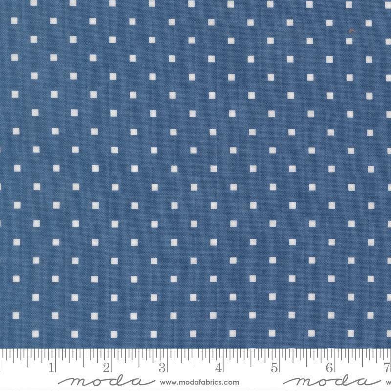 Image of A Cat Named Stitch Cosmo Sea quilting cotton fabric by Camille Roskelley for Riley Blake Designs. Features polka dot squares on a blue background. Cute Little Fabric Shop.