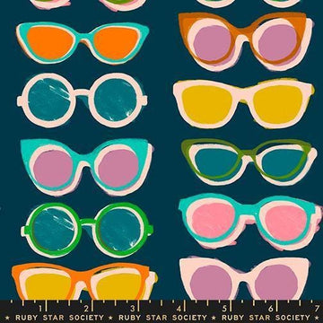 Image of Poolside Too Shades Peacock quilting cotton fabric by Ruby Star Society for Moda Fabrics. Features sunglasses on a blue background. Cute Little Fabric Shop.