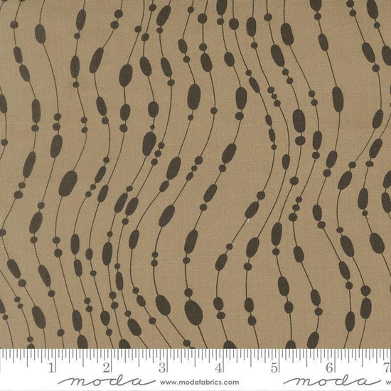 Image of Mira Whisper Taupe quilting cotton fabric by Zen Chic for Moda Fabrics. Features dots on a brown background. Cute Little Fabric Shop.