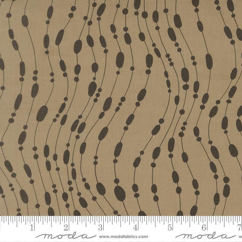 Image of Mira Whisper Taupe quilting cotton fabric by Zen Chic for Moda Fabrics. Features dots on a brown background. Cute Little Fabric Shop.