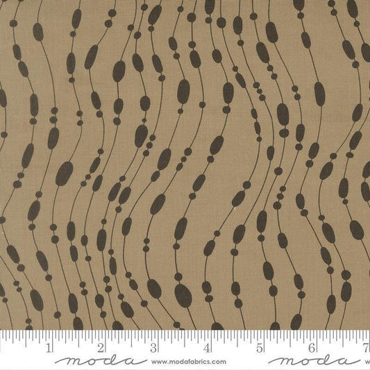 Image of Mira Whisper Taupe quilting cotton fabric by Zen Chic for Moda Fabrics. Features dots on a brown background. Cute Little Fabric Shop.