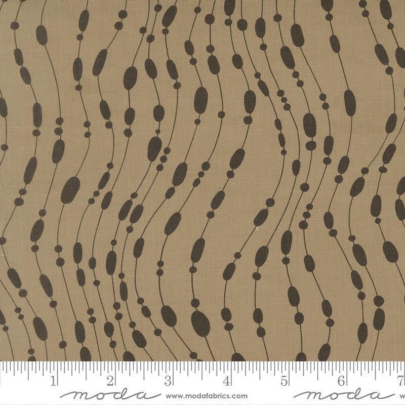 Image of Mira Whisper Taupe quilting cotton fabric by Zen Chic for Moda Fabrics. Features dots on a brown background. Cute Little Fabric Shop.