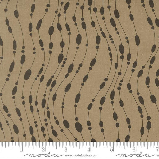 Image of Mira Whisper Taupe quilting cotton fabric by Zen Chic for Moda Fabrics. Features dots on a brown background. Cute Little Fabric Shop.
