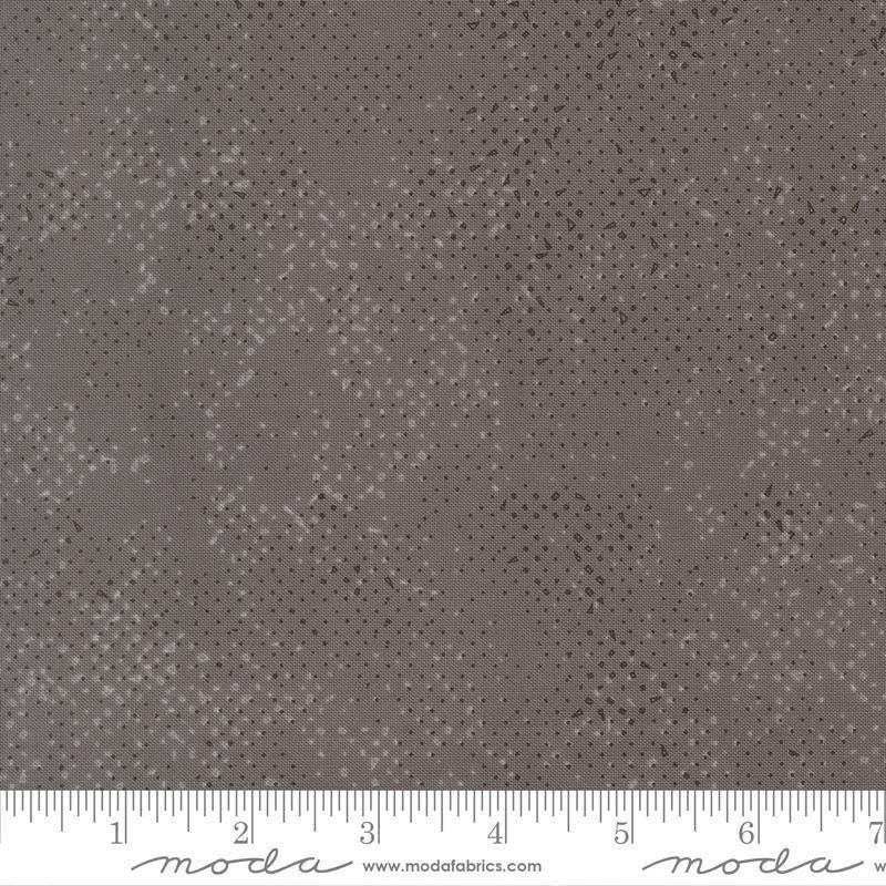 Image of Mira Spotted Graphite quilting cotton fabric by Zen Chic for Moda Fabrics. Features printed texture on a gray background. Cute Little Fabric Shop.