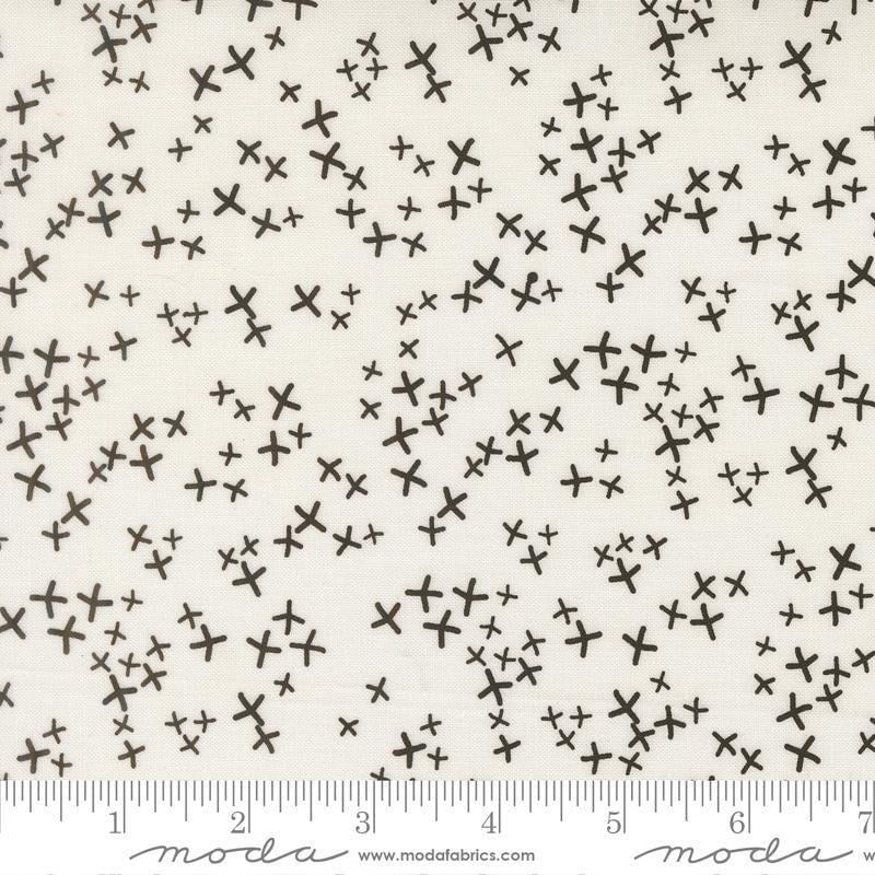 Image of Mira Realm Pearl quilting cotton fabric by Zen Chic for Moda Fabrics. Features crosses on a white background. Cute Little Fabric Shop.