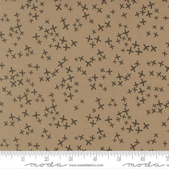 Image of Mira Realm Taupe quilting cotton fabric by Zen Chic for Moda Fabrics. Features crosses on a brown background. Cute Little Fabric Shop.