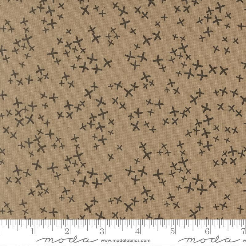 Image of Mira Realm Taupe quilting cotton fabric by Zen Chic for Moda Fabrics. Features crosses on a brown background. Cute Little Fabric Shop.