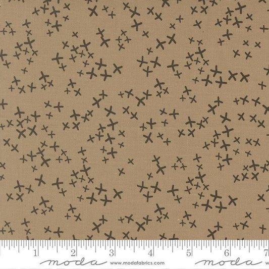 Image of Mira Realm Taupe quilting cotton fabric by Zen Chic for Moda Fabrics. Features crosses on a brown background. Cute Little Fabric Shop.
