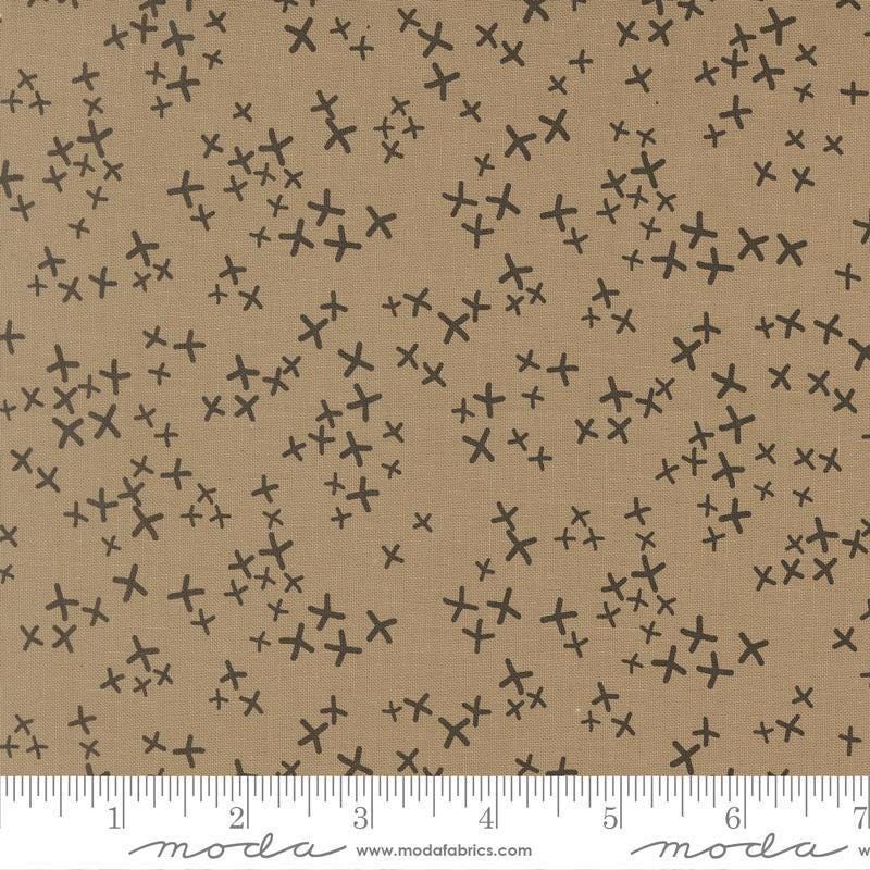 Image of Mira Realm Taupe quilting cotton fabric by Zen Chic for Moda Fabrics. Features crosses on a brown background. Cute Little Fabric Shop.