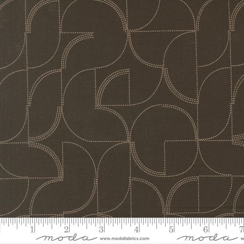 Image of Mira Echo Onyx quilting cotton fabric by Zen Chic for Moda Fabrics. Features a geometric pattern on a brown background. Cute Little Fabric Shop.