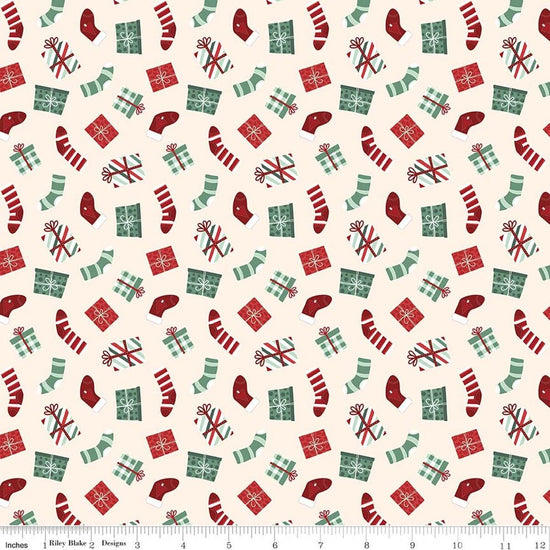 Image of Evergreen Wishes Stockings & Gifts Cream quilting cotton fabric by Traci Reed for Riley Blake Designs. Features presents on a white background. Cute Little Fabric Shop.