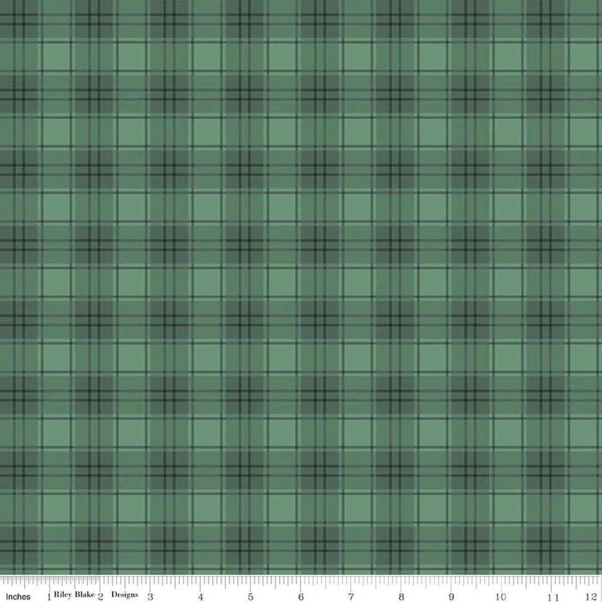 Image of Evergreen Wishes Plaid Green quilting cotton fabric by Traci Reed for Riley Blake Designs. Features plaid on a green background. Cute Little Fabric Shop.