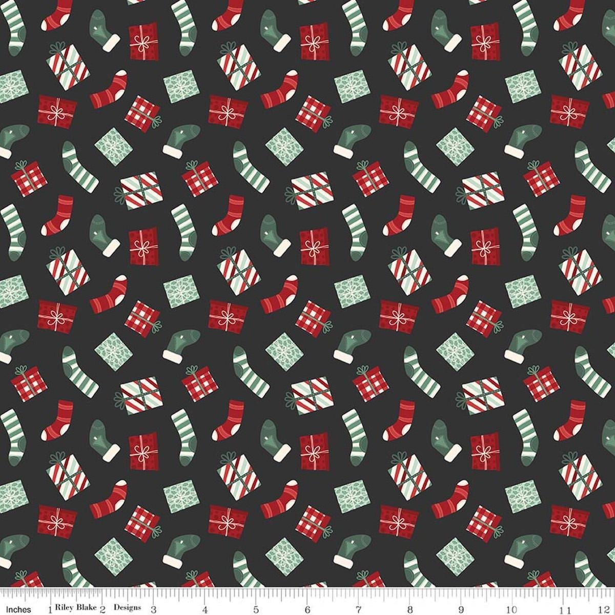 Image of Evergreen Wishes Stockings & Gifts Black quilting cotton fabric by Traci Reed for Riley Blake Designs. Features presents on a black background. Cute Little Fabric Shop.