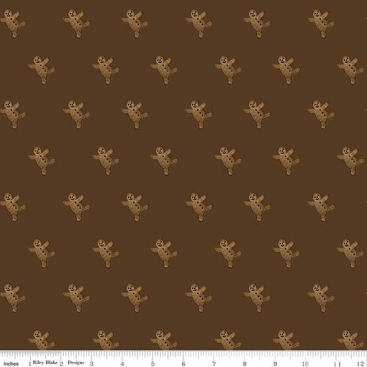 Image of Gingerbread Gingerbread Toss Brown quilting cotton fabric by J. Wecker Frisch for Riley Blake Designs. Features gingerbread men on a brown background. Cute Little Fabric Shop.