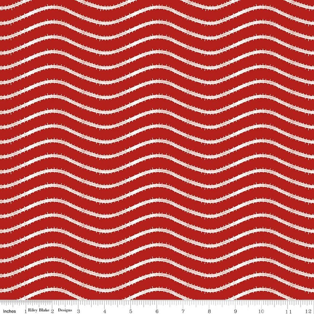 Image of Gingerbread Icing Stripe Red quilting cotton fabric by J. Wecker Frisch for Riley Blake Designs. Features wavy stripes on a red background. Cute Little Fabric Shop.