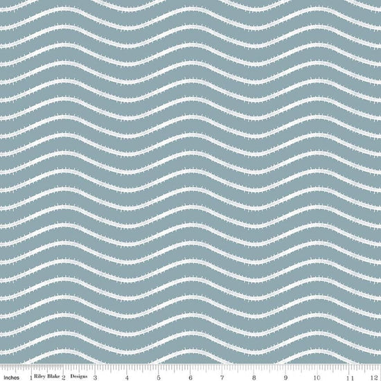 Image of Gingerbread Icing Stripes Blue quilting cotton fabric by J. Wecker Frisch for Riley Blake Designs. Features wavy stripes on a blue background. Cute Little Fabric Shop.
