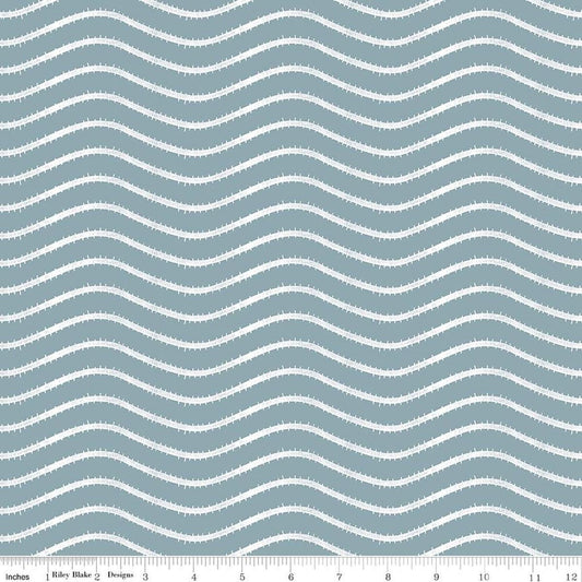 Image of Gingerbread Icing Stripes Blue quilting cotton fabric by J. Wecker Frisch for Riley Blake Designs. Features wavy stripes on a blue background. Cute Little Fabric Shop.