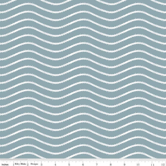 Image of Gingerbread Icing Stripes Blue quilting cotton fabric by J. Wecker Frisch for Riley Blake Designs. Features wavy stripes on a blue background. Cute Little Fabric Shop.