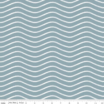 Image of Gingerbread Icing Stripes Blue quilting cotton fabric by J. Wecker Frisch for Riley Blake Designs. Features wavy stripes on a blue background. Cute Little Fabric Shop.
