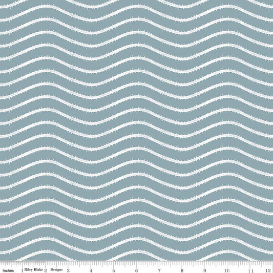 Image of Gingerbread Icing Stripes Blue quilting cotton fabric by J. Wecker Frisch for Riley Blake Designs. Features wavy stripes on a blue background. Cute Little Fabric Shop.
