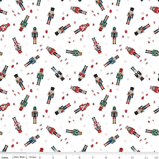 Image of Nutcracker Tradition Nutcracker Toss Snow quilting cotton fabric by Jennifer Long for Riley Blake Designs. Features nutcrackers on a white background. Cute Little Fabric Shop.