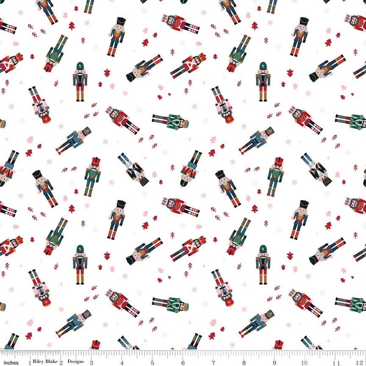Image of Nutcracker Tradition Nutcracker Toss Snow quilting cotton fabric by Jennifer Long for Riley Blake Designs. Features nutcrackers on a white background. Cute Little Fabric Shop.