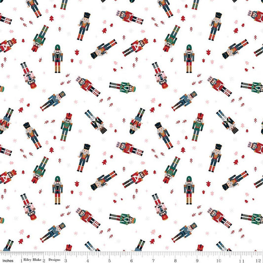 Image of Nutcracker Tradition Nutcracker Toss Snow quilting cotton fabric by Jennifer Long for Riley Blake Designs. Features nutcrackers on a white background. Cute Little Fabric Shop.