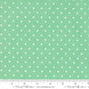 Image of A Cat Named Stitch Cosmo Green quilting cotton fabric by Camille Roskelley for Riley Blake Designs. Features polka dot squares on a green background. Cute Little Fabric Shop.
