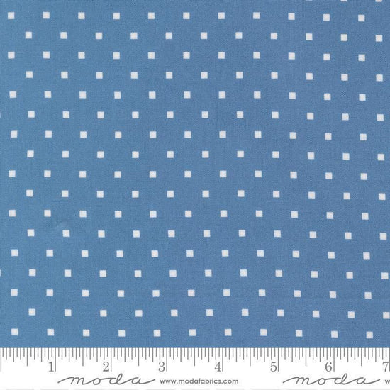 Image of A Cat Named Stitch Cosmo Blue quilting cotton fabric by Camille Roskelley for Riley Blake Designs. Features polka dot square on a blue background. Cute Little Fabric Shop.