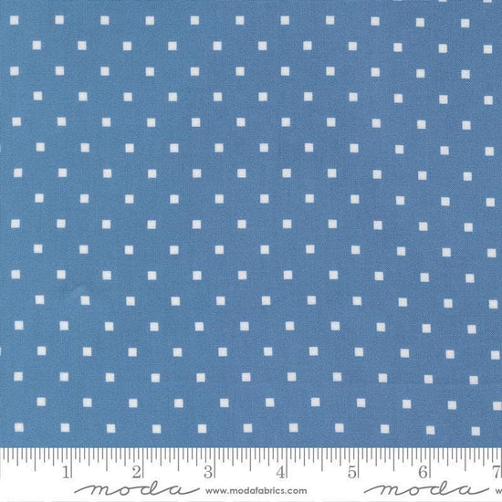 Image of A Cat Named Stitch Cosmo Blue quilting cotton fabric by Camille Roskelley for Riley Blake Designs. Features polka dot square on a blue background. Cute Little Fabric Shop.