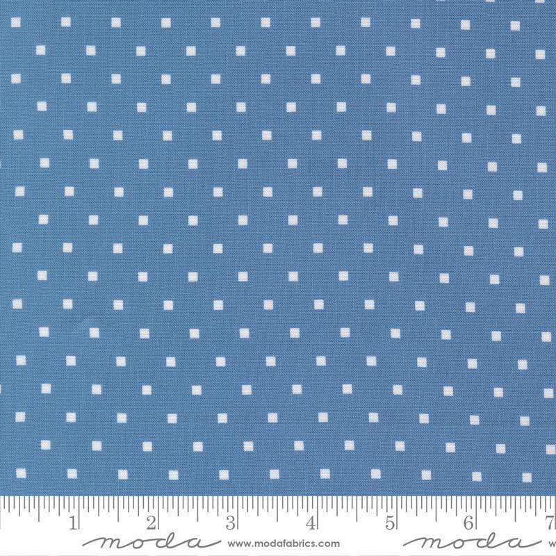 Image of A Cat Named Stitch Cosmo Blue quilting cotton fabric by Camille Roskelley for Riley Blake Designs. Features polka dot square on a blue background. Cute Little Fabric Shop.