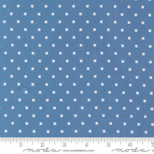 Image of A Cat Named Stitch Cosmo Blue quilting cotton fabric by Camille Roskelley for Riley Blake Designs. Features polka dot square on a blue background. Cute Little Fabric Shop.