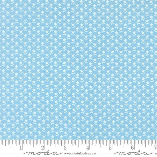 Image of A Cat Named Stitch June Sky quilting cotton fabric by Camille Roskelley for Riley Blake Designs. Features flowers on a blue background. Cute Little Fabric Shop.