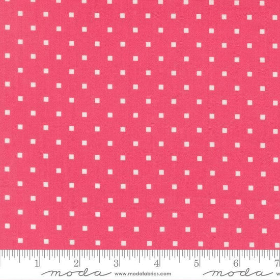 Image of A Cat Named Stitch Cosmo Rosie quilting cotton fabric by Camille Roskelley for Riley Blake Designs. Features polka dot squares on a pink background. Cute Little Fabric Shop.