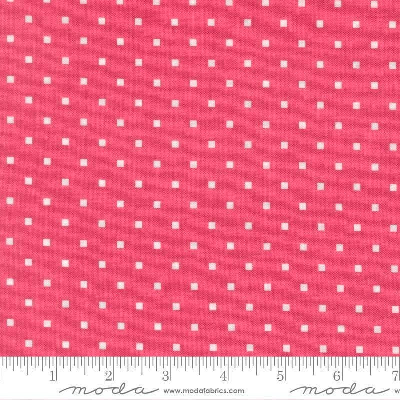 Image of A Cat Named Stitch Cosmo Rosie quilting cotton fabric by Camille Roskelley for Riley Blake Designs. Features polka dot squares on a pink background. Cute Little Fabric Shop.