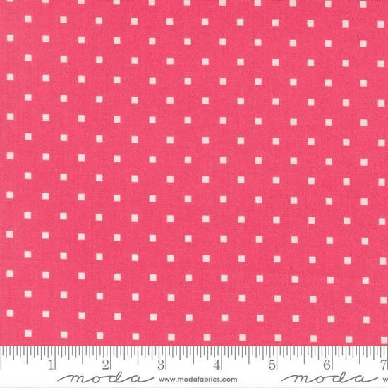 Image of A Cat Named Stitch Cosmo Rosie quilting cotton fabric by Camille Roskelley for Riley Blake Designs. Features polka dot squares on a pink background. Cute Little Fabric Shop.