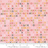 Image of Fieldrush Larkspur Peony quilting cotton fabric by Basic Grey for Moda Fabrics. Features Xs on a pink background. Cute Little Fabric Shop.