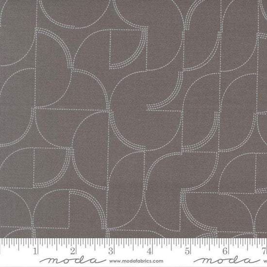 Image of Mira Echo Graphite quilting cotton fabric by Zen Chic for Moda Fabrics. Features a geometric pattern on a gray background. Cute Little Fabric Shop.