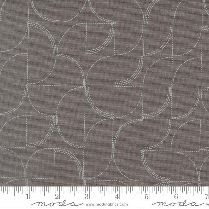 Image of Mira Echo Graphite quilting cotton fabric by Zen Chic for Moda Fabrics. Features a geometric pattern on a gray background. Cute Little Fabric Shop.