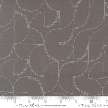Image of Mira Echo Graphite quilting cotton fabric by Zen Chic for Moda Fabrics. Features a geometric pattern on a gray background. Cute Little Fabric Shop.
