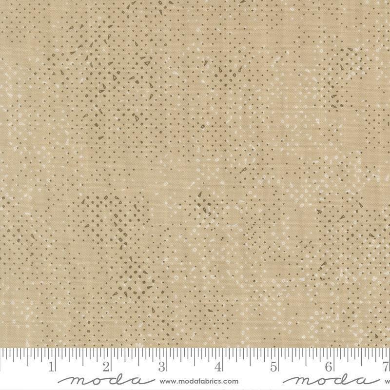 Image of Mira Spotted Tan quilting cotton fabric by Zen Chic for Moda Fabrics. Features printed texture on a brown background. Cute Little Fabric Shop.