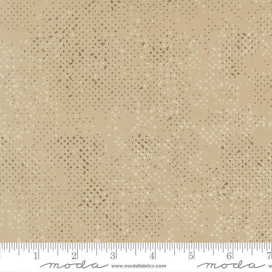 Image of Mira Spotted Tan quilting cotton fabric by Zen Chic for Moda Fabrics. Features printed texture on a brown background. Cute Little Fabric Shop.