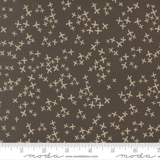 Image of Mira Realm Charcoal quilting cotton fabric by Zen Chic for Moda Fabrics. Features crosses on a brown background. Cute Little Fabric Shop.