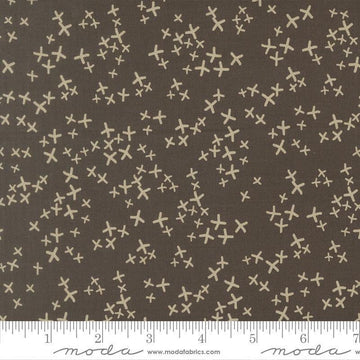 Image of Mira Realm Charcoal quilting cotton fabric by Zen Chic for Moda Fabrics. Features crosses on a brown background. Cute Little Fabric Shop.